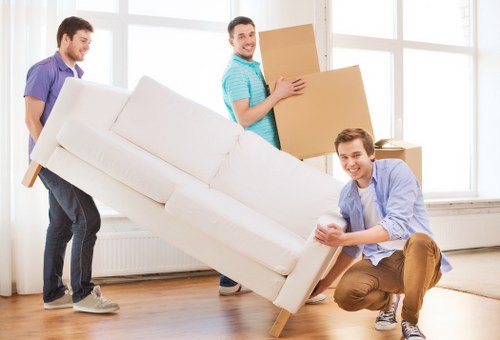 Loading office desks and chairs for transport in Hendon